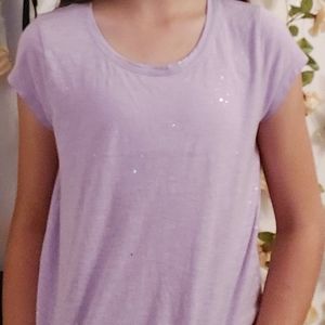A sparkly purple tee shirt